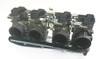 Mikuni Radial Flat Slide Carburetors, motorcycle carburetor set with black throttle bodies and metallic components.