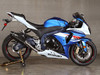 M4 Performance Exhausts M4 Tech1 Carbon Exhaust Suzuki GSXR1000 12-16, installed on a blue and white Suzuki GSXR1000 motorcycle.