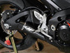 M4 Performance Exhausts M4 GP Black Slip On Exhaust Suzuki GSXR1000 (07-08), close-up of the black slip-on exhaust system installed on the motorcycle's black frame and rear wheel area.