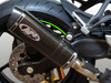 M4 Performance Exhausts M4 X-96 Carbon Fiber Slip On Exhaust for Kawasaki ZX-4RR (23-25), close-up of the sleek, black carbon fiber muffler attached to the motorcycle's rear wheel and frame.
