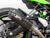 M4 Performance Exhausts M4 X-96 Carbon Fiber Full Exhaust Kawasaki ZX-4RR (23-25), close-up of the carbon fiber and metallic exhaust pipe on a green motorcycle.