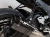 M4 Performance Exhausts M4 Tech1 Carbon Exhaust Kawasaki ZX-10R (16-25), close-up of a high-performance carbon fiber exhaust system installed on a Kawasaki ZX-10R motorcycle.