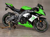 M4 Performance Exhausts M4 Street Slayer Carbon Slip On Exhaust Kawasaki ZX-10R (08-10), a green and black sport motorcycle with aftermarket exhaust system.