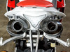 M4 Performance Exhausts M4 Undertail Carbon Fiber Slip On Exhaust Yamaha YZF-R1 (09-14), close-up view of the dual carbon fiber slip-on exhaust pipes on a sports motorcycle.