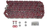 EK Chain 525 ZVX-3 X-Ring, a red and silver motorcycle chain with black rubber O-rings, alongside chain link pins, O-rings, and a small packet of lubrication or maintenance grease.