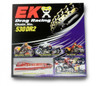 EK Chain 530 DR-2 Drag Chain, black and gold motorcycle chain coiled on packaging box with racing images in the background.
