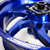 Coremoto Apex-6 Forged Aluminum Wheels Yamaha YZF-R1 (15-26), close-up image of a blue forged aluminum motorcycle wheel with detailed craftsmanship and branding.