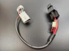 VooDoo Voodoo Ignition Delete Suzuki Hayabusa (22-25), motorcycle ignition delete wiring harness with electronic components on a black surface.