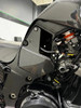 AGM Carbon Fiber Battery Cover Kawasaki ZX-14 (12-26), close-up view of the sleek, lightweight carbon fiber battery cover installed on a Kawasaki ZX-14 motorcycle.