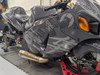 DME Mark1 Sidewinder Exhaust System, motorcycle racing bike with custom exhaust installed in a garage.