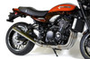Brocks Performance Brocks StreetMeg Full Exhaust System 20'' Muffler for Kawasaki Z900RS (18-25), black and stainless steel motorcycle exhaust with carbon fiber end cap, installed on a black and orange Kawasaki Z900RS motorcycle.