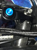 Penske Racing Shocks, Penske Air Drag Shock open box for Suzuki Hayabusa 2008-2021, showcasing the shock absorber with blue LED lights, surrounded by cables and carbon fiber components. Penske Racing Shocks, Penske Air Drag Shock open box for Suzuki Hayabusa 2008-2021, showcasing the shock absorber with blue LED lights, surrounded by cables and carbon fiber components.