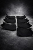 Lo Pro Racing Alcantara Cut Seat GSXR1000 (17-25), black racing motorcycle seat pads for GSXR1000 model from 2017 to 2025 arranged on a textured surface.