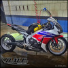 DME Racing Motorcycle Parts, DME Aluminum Swingarm for Honda CBR1000RR (2004-2025) with a motorcycle in a cleaning station.