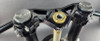 VooDoo Motorcycle Components Voodoo Top Triple Clamp Suzuki GSXR1000 (09-25) Open Box, close-up image of motorcycle top triple clamp with black finish and gold steering stem nut.