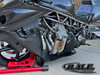 DME Racing Motorcycle Parts DME Zoomie Exhaust System, motorcycle engine with stainless steel exhaust pipes installed on a high-performance bike.