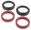 Moose Fork Seal Kit Kawasaki KLR650, image showing four seal components including two black seals with pink interior and two red seals.