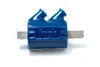 Dynatek Dyna Coils, blue ignition coil with dual high-voltage output terminals and metal mounting bracket.