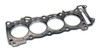 Cometic Head Gasket Suzuki Hayabusa (99-26), close-up of engine head gasket with circular cutouts for cylinders and detailed gasket surface for engine sealing.