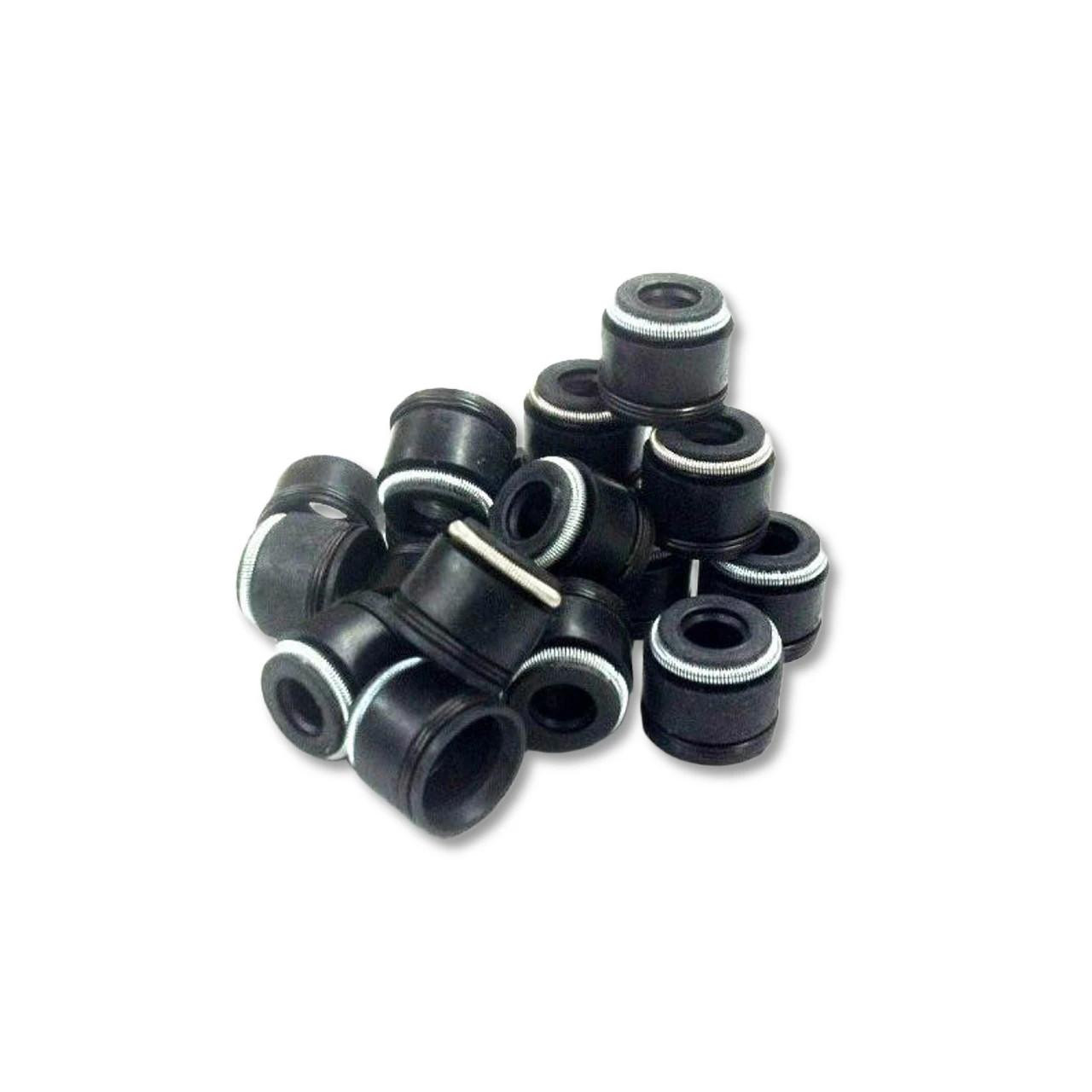 Schnitz Racing Schnitz Valve Seal 5mm, close-up of multiple black valve seals with white sealing rings arranged in a pile.