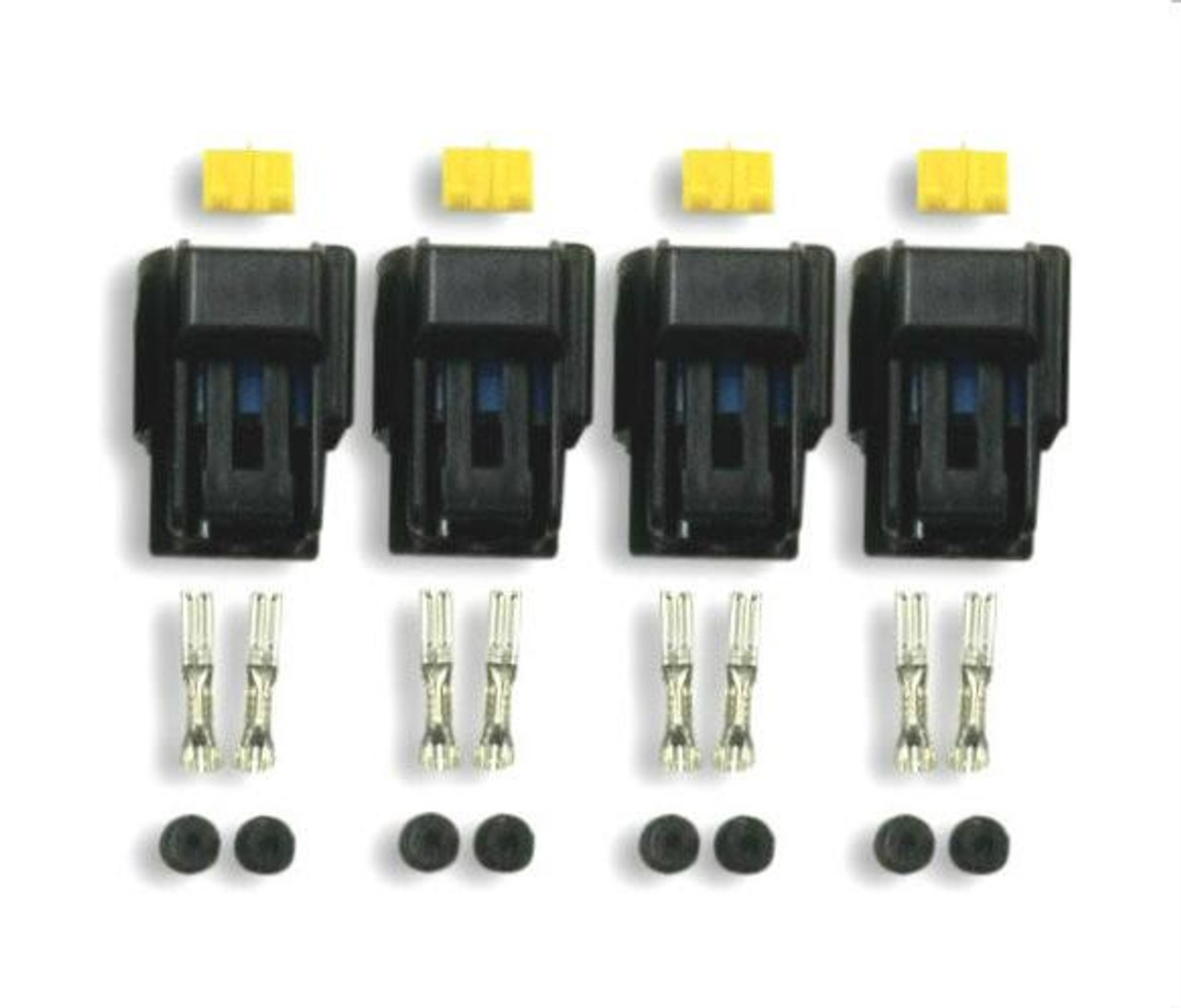 Schnitz Racing Schnitz Stick Coil Connector Kit, automotive coil connector components with black connectors, yellow locking tabs, silver metal terminals, and rubber seals laid out in a row. Schnitz Racing Schnitz Stick Coil Connector Kit, automotive coil connector components with black connectors, yellow locking tabs, silver metal terminals, and rubber seals laid out in a row.