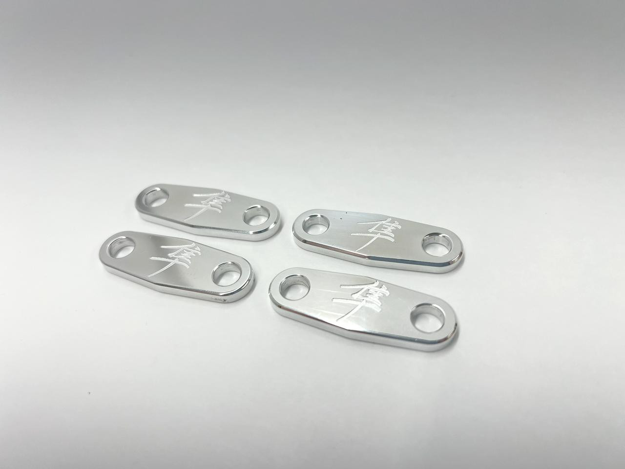 Schnitz Racing Schnitz Air Injection Block Off Plates Suzuki GSX1300R Hayabusa (99-07), set of four silver metallic anodized aluminum plates with engraved logo and two mounting holes each.