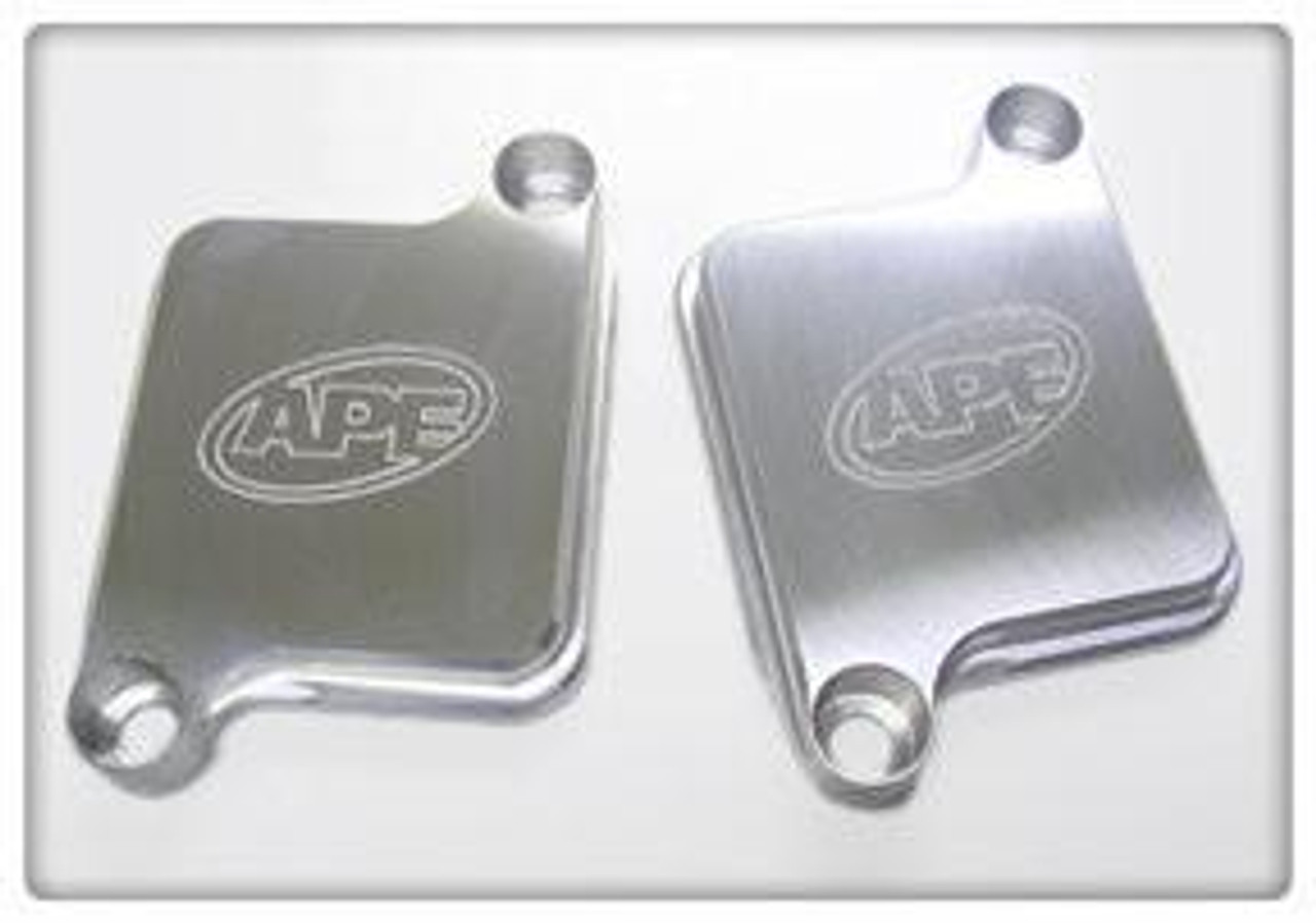 APE Air Injection Block Off Plates Suzuki Hayabusa (08-26), close-up shot of metallic air injection block off plates with APE logo for motorcycle exhaust system modification.