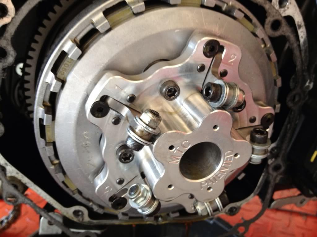 MTC Multistage Lock Up Clutch Kawasaki ZX14 (06-11), close-up of the multistage lock-up clutch used in Kawasaki ZX14 motorcycle engine, showing metallic components and intricate assembly.