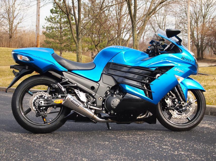 Brocks Performance Brocks Alien Head 2 Full Exhaust 14" Muffler Kawasaki ZX14R (12-25), blue sport motorcycle parked outdoors on asphalt with leafless trees in the background.