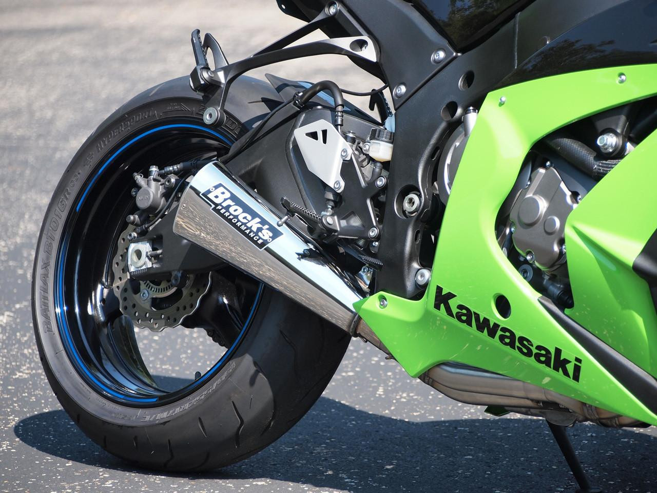 Brocks Performance Brocks Alien Head 2 Full Exhaust 14" Muffler Kawasaki ZX10R (11-15), close-up of a motorcycle's rear wheel and exhaust system showing the aftermarket muffler with branding.
