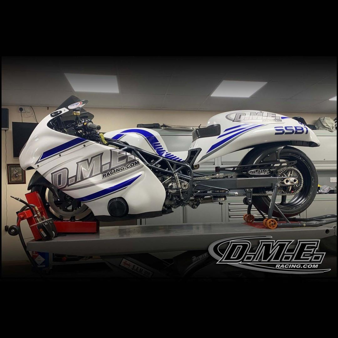 DME Aluminum Swingarm Kawasaki ZX10R (06-07), motorcycle racing part on work stand in garage.