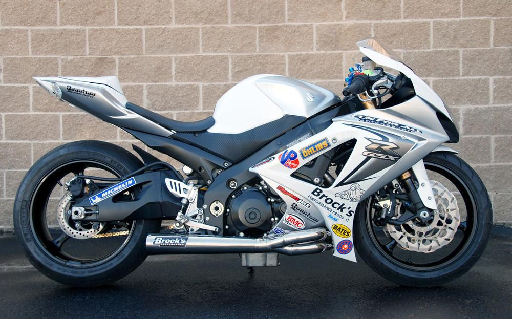 Brocks Performance Brocks Tiwind Full Exhaust Street Baffle Suzuki GSXR1000 (07-08), motorcycle with silver and black fairings, racing decals, and aftermarket exhaust system.