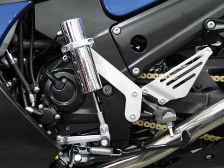 Pingel Easy Shift Electric Shifter Universal Kit For 1" Handlebars, close-up of the motorcycle's gear shifting system with metallic components and black engine parts.