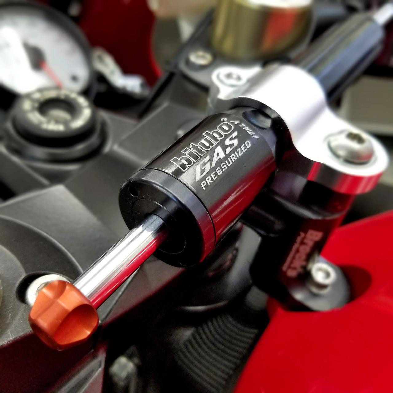 Brocks Performance Brocks Bitubo Steering Damper Kit Kawasaki ZX14R (06-25) Black, close-up of a black and silver steering damper installed on a motorcycle handlebar.