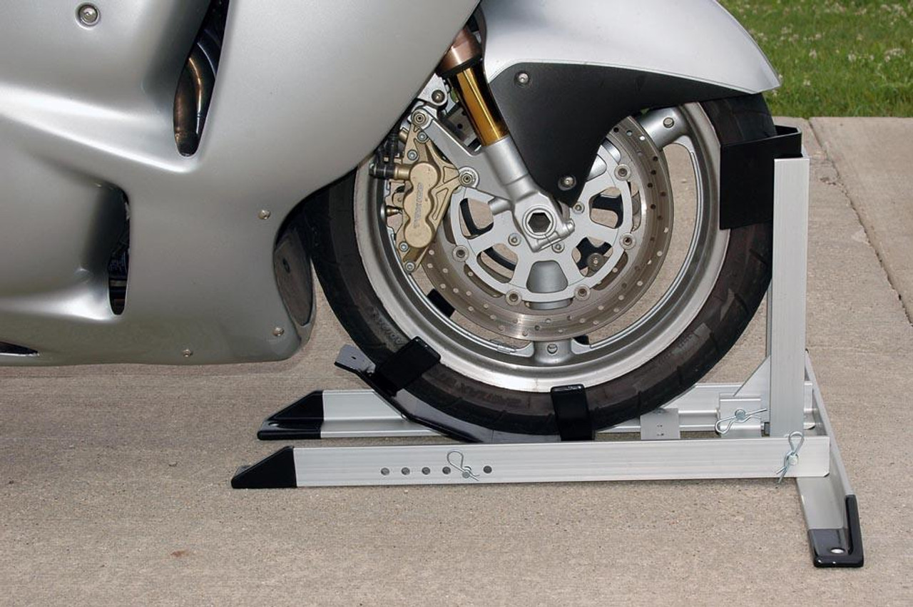 Condor Pit Stop/Trailer Wheel Chock, motorcycle wheel chock securing a motorcycle tire for stability and safety.