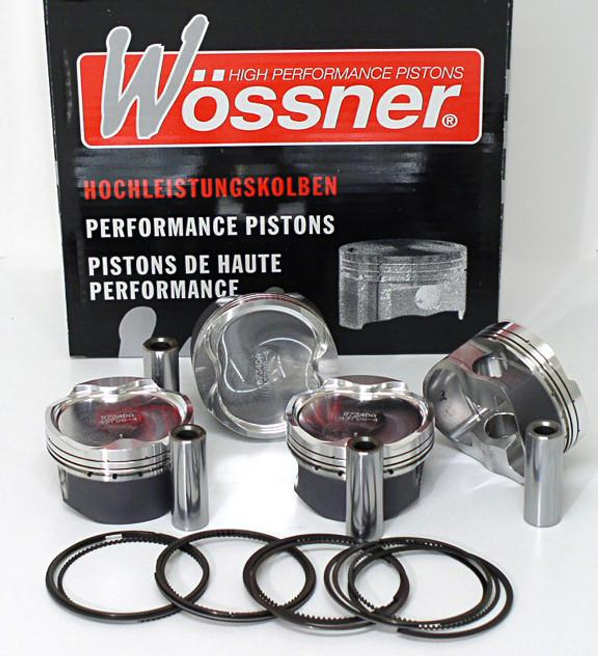 Wossner Piston Kit Suzuki GSXR1000 (01-16), high performance pistons with piston rings and wrist pins displayed in front of packaging box.
