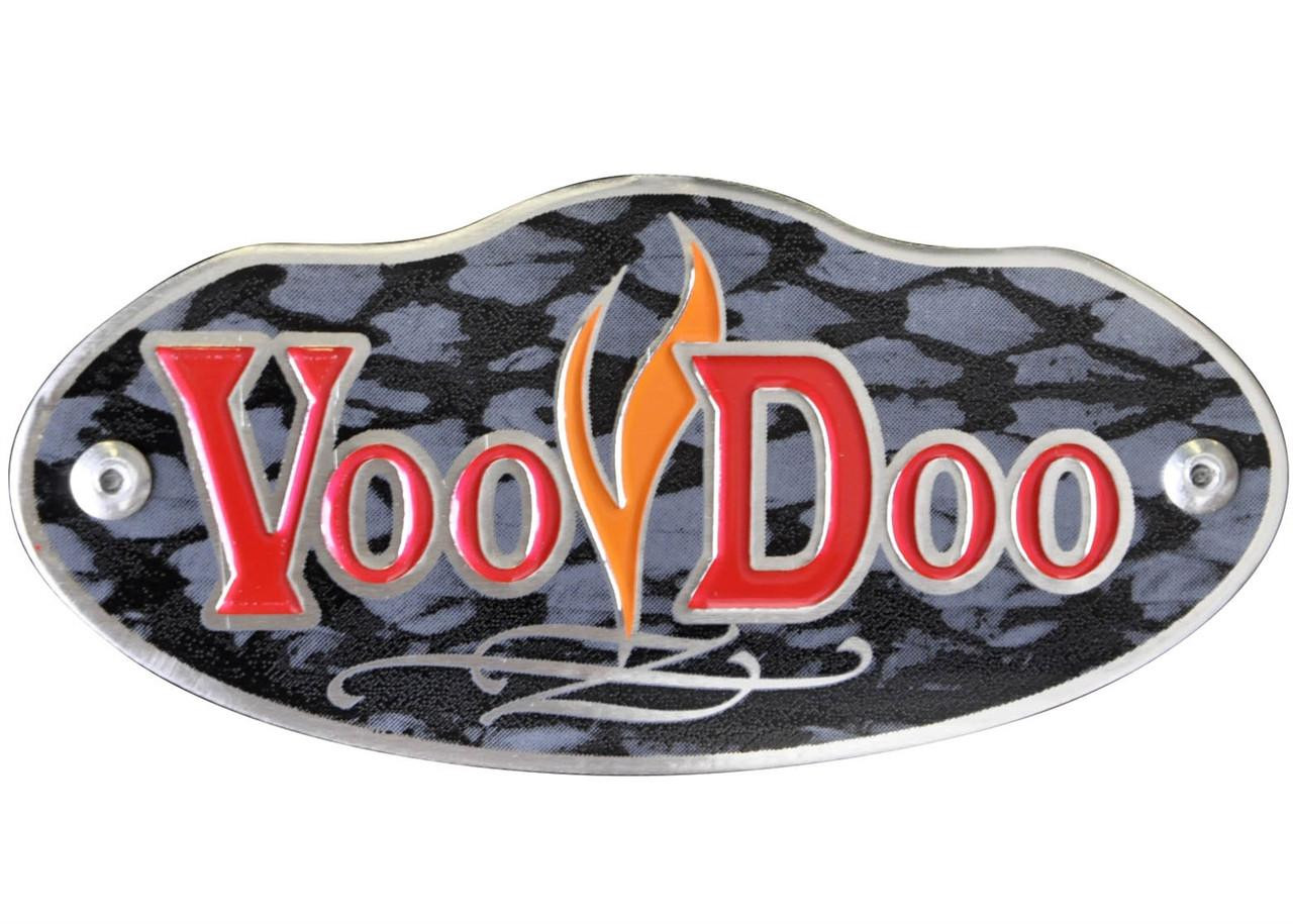 VooDoo Performance Series Half Exhaust Suzuki GSXR750 (06-07), GSXR600 (06-07), close-up image of the logo on the exhaust pipe with black and gray camouflage pattern background. VooDoo Performance Series Half Exhaust Suzuki GSXR750 (06-07), GSXR600 (06-07), close-up image of the logo on the exhaust pipe with black and gray camouflage pattern background.