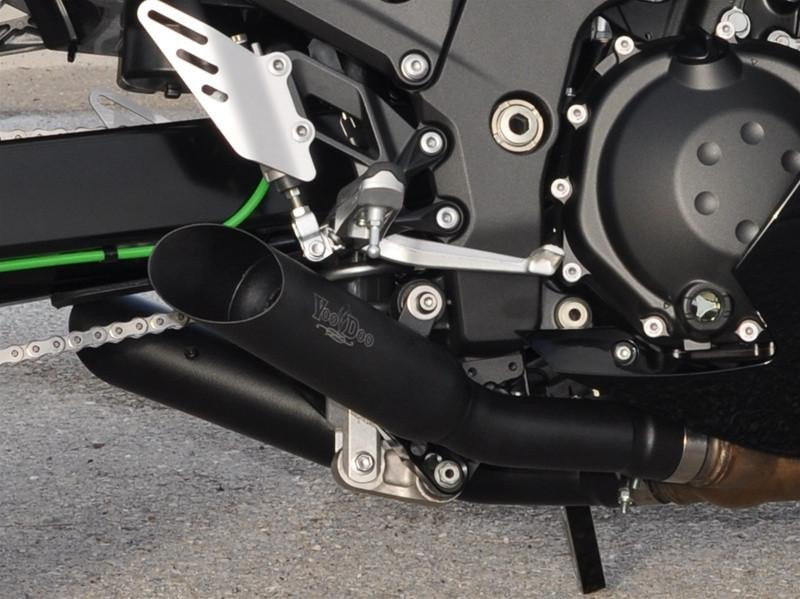 VooDoo Shorty Slip On Exhaust for Kawasaki ZX14R (12-25), close-up view of the black motorcycle exhaust pipe attached to the bike's engine.