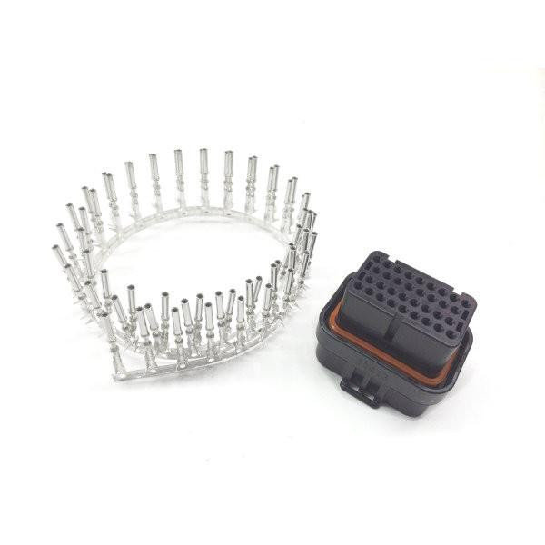 Motec 34 Pin CDL3/C125 Connector Kit, includes a circular arrangement of 34 metal pins and a black plastic connector housing with multiple pin slots for electrical connections.