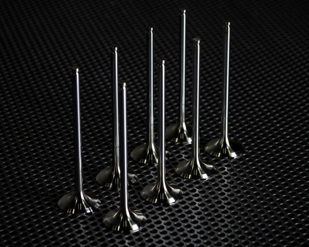 Vance & Hines Stainless Steel Exhaust Valves Suzuki GSXR1000 (09-16), set of eight stainless steel exhaust valves arranged on a black textured surface.