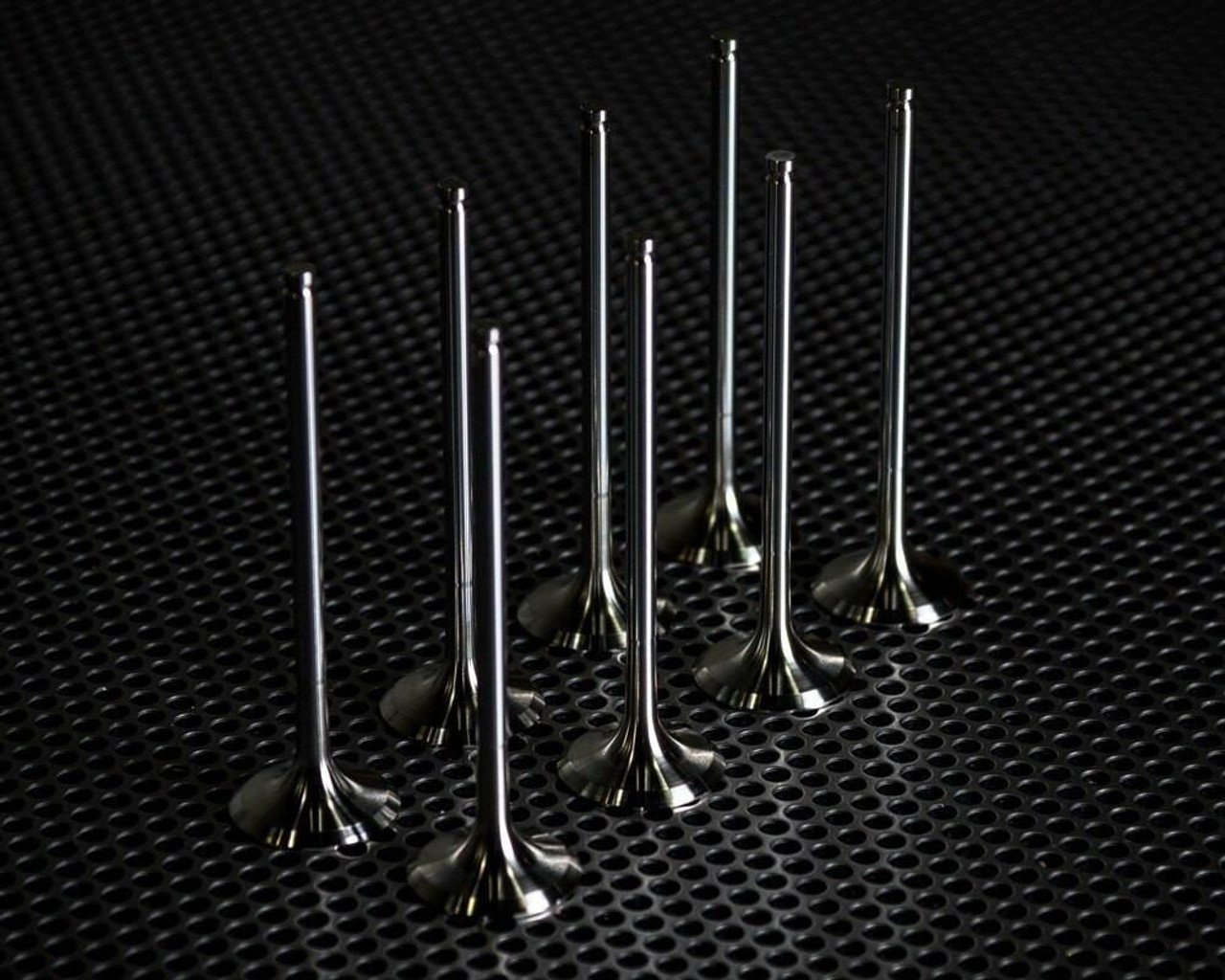 Vance & Hines Titanium Exhaust Valves Yamaha FZ/MT/R7 (15-23), high-performance titanium exhaust valves arranged on a textured black surface. Vance & Hines Titanium Exhaust Valves Yamaha FZ/MT/R7 (15-23), high-performance titanium exhaust valves arranged on a textured black surface.