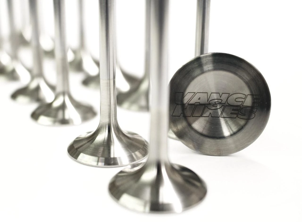 Vance & Hines Titanium Exhaust Valves Yamaha FZ/MT/R7 (15-23), close-up of high-performance titanium exhaust valves with Vance & Hines logo engraved on the top surface, sleek metallic finish.