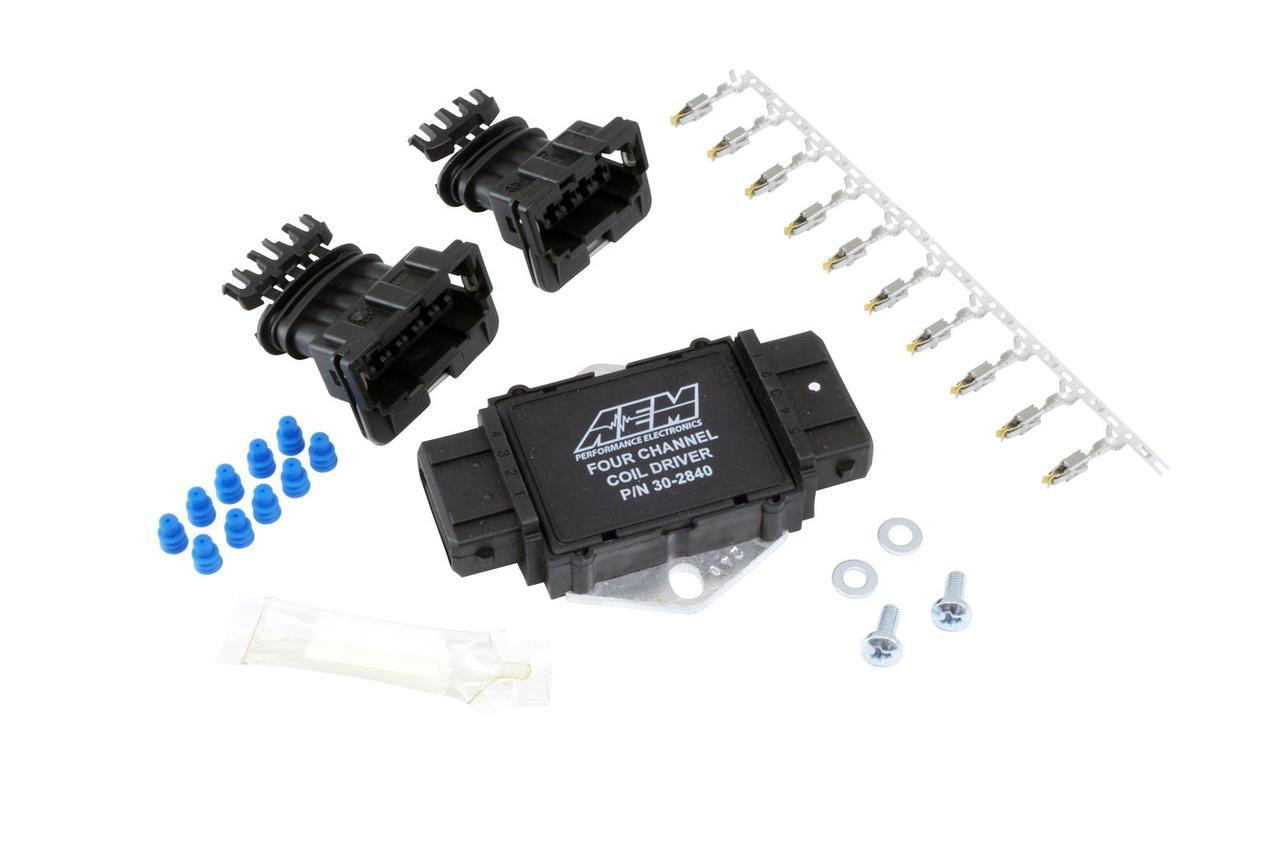 AEM Infinity 4 Channel Ignitor Coil Driver, automotive ignition control module with wiring harness and installation accessories.