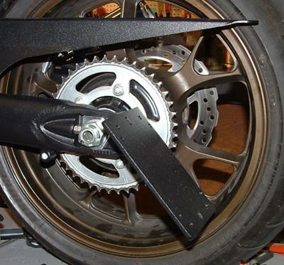 Tiger Racing License Plate Bracket Swingarm Mount Kawasaki ZX14, close-up view of the black metal license plate bracket attached to the rear wheel swingarm of a Kawasaki ZX14 motorcycle.