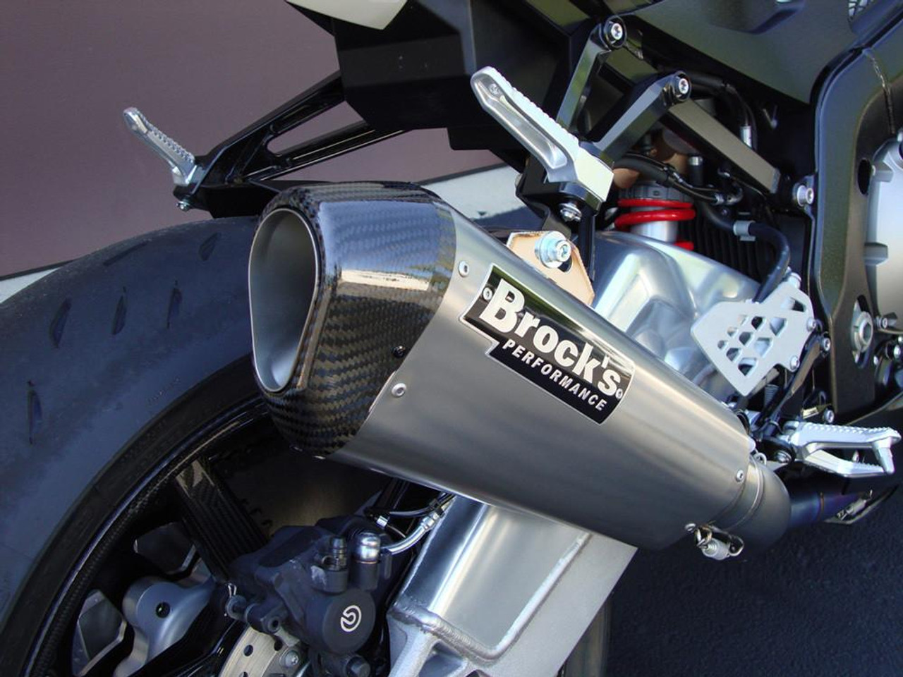 Brocks Performance Brocks CT Single Full Exhaust 16" Muffler BMW S1000RR (10-14), close-up of a metallic exhaust muffler with Brocks Performance branding installed on a motorcycle.