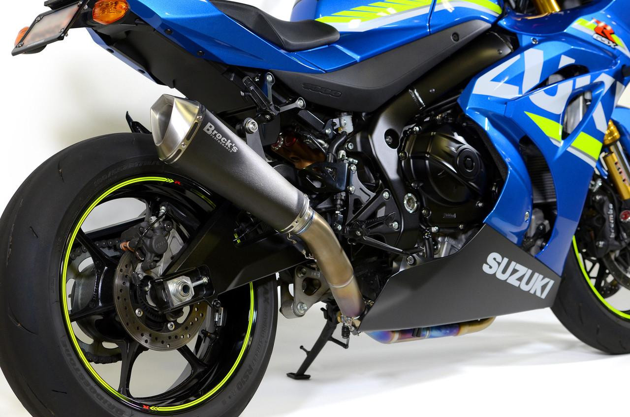 Brocks Performance Brocks Predator Full Exhaust Ti Front Electro-Black Muffler Suzuki GSXR1000 (17-27), close-up of the motorcycle's rear and exhaust system showcasing the titanium muffler with black and silver finish.