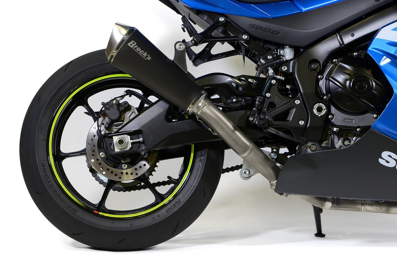 Brocks Performance Brocks Predator Full Exhaust Stainless Front Electro-Black Muffler Suzuki GSXR1000 (17-27), close-up view of motorcycle's rear wheel and exhaust system.