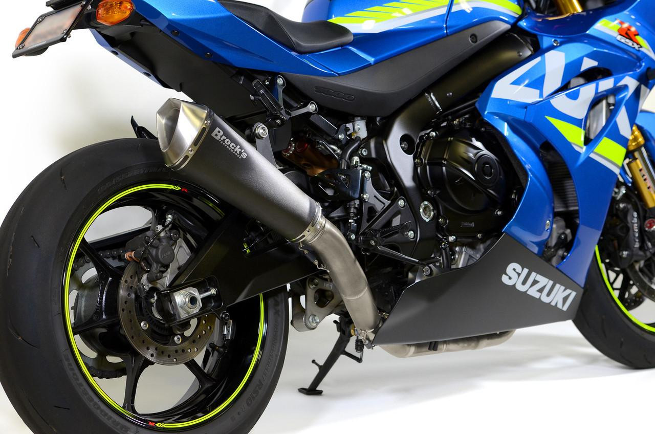 Brocks Performance Brocks Predator Full Exhaust Stainless Front Electro-Black Muffler on a Suzuki GSXR1000 (17-25) motorcycle, showcasing the exhaust system and rear wheel in a close-up view.