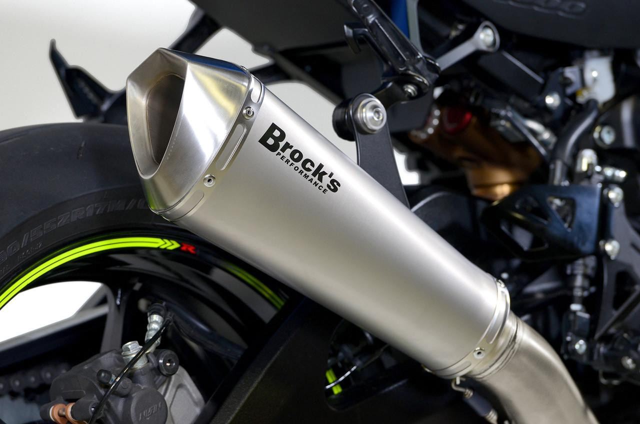 Brocks Performance Brocks Predator Full Exhaust Stainless Front Titanium Muffler Suzuki GSXR1000 (17-25), close-up view of the stainless steel and titanium exhaust muffler attached to the motorcycle. Brocks Performance Brocks Predator Full Exhaust Stainless Front Titanium Muffler Suzuki GSXR1000 (17-25), close-up view of the stainless steel and titanium exhaust muffler attached to the motorcycle.