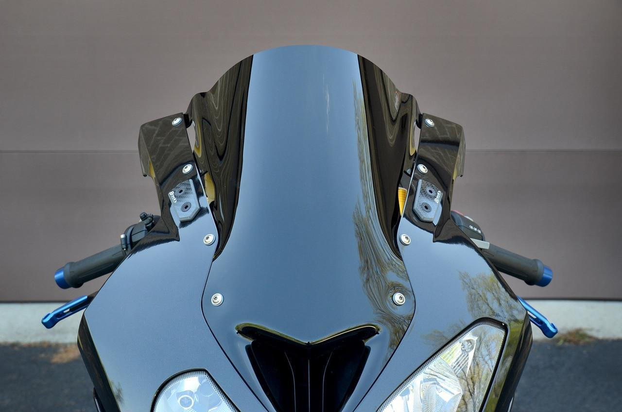 Brocks Performance Brocks Carbon Fiber Mirror Block Off Plates for BMW S1000RR and HP4 motorcycle, close-up view showing sleek black carbon fiber design and mounting hardware.